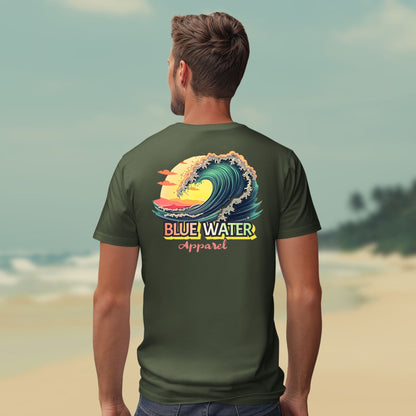 Male model on beach wearing the vintage surf tee in military green by blue water apparel
