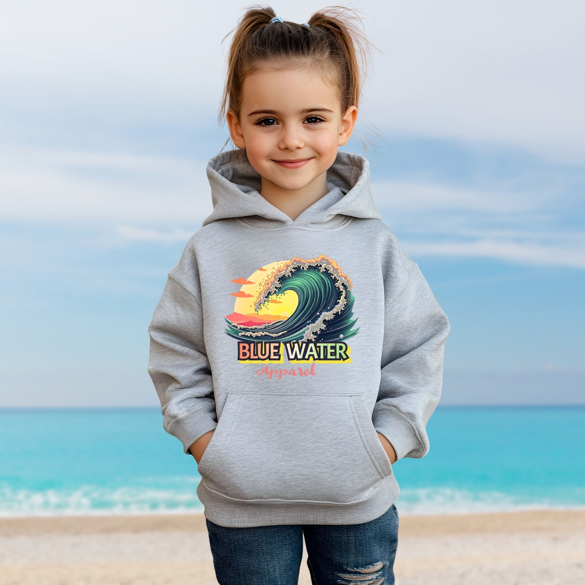 child model on beach wearing sport grey vintage surf kids hoodie by blue water apparel