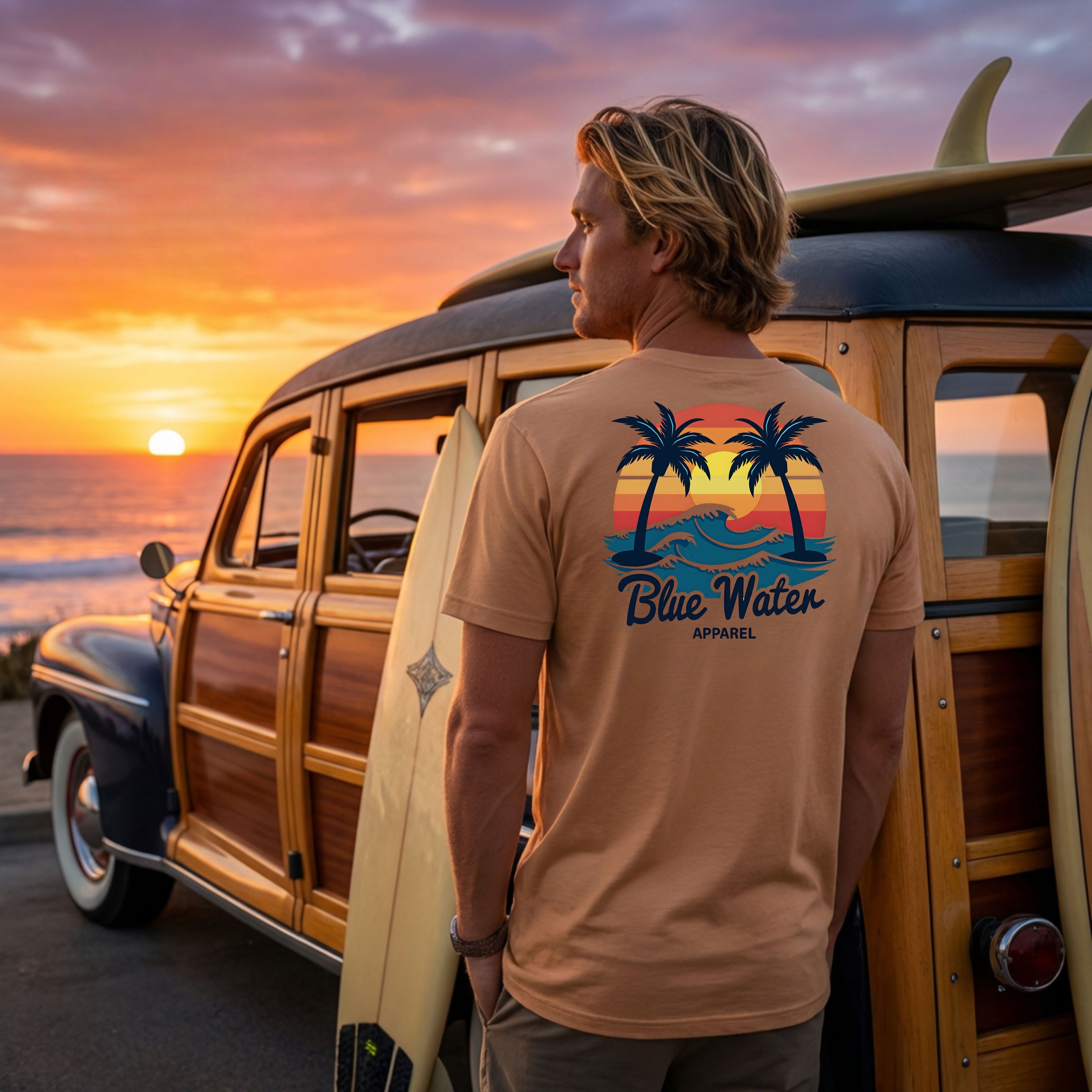 Surfer wearing toast vintage sunset tee leaning against vintage wagon by blue water apparel
