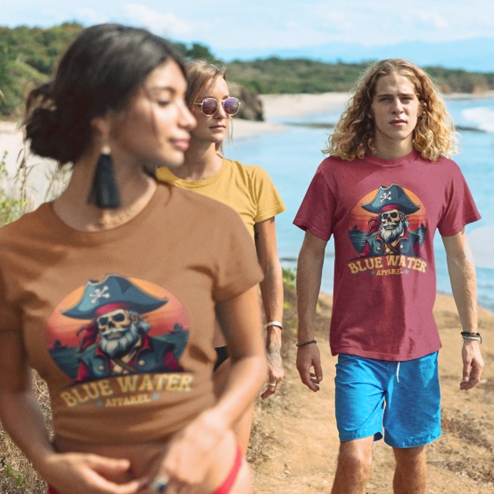 Models on beach wearing Vintage Pirate Cardinal and Toast tees by Blue Water Apparel